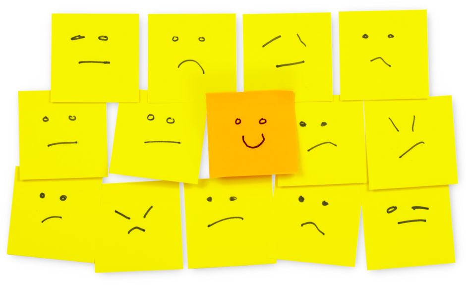 Postits mit Strichzeichnungen, die Gesichtsausdrücke wie Freude, Ärger, Gleichgültigkeit zeigen